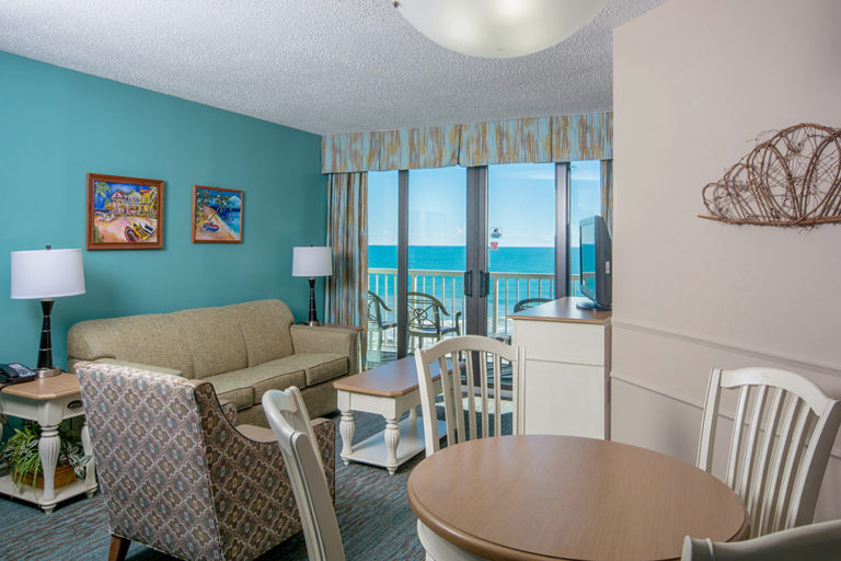 Oceanfront Deluxe Queen Suite Dining & Living Room